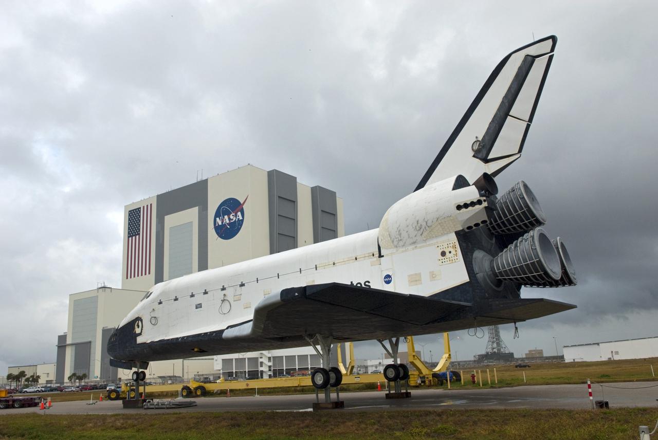 CAPE CANAVERAL, Fla. – Wheels are installed on the high-fidelity space shuttle model following its arrival at Kennedy's Launch Complex 39 turn basin in Florida.  The model was on display at the NASA Kennedy Space Center Visitor Complex until recently. Behind it is the 525-foot-tall Vehicle Assembly Building.    The shuttle was part of a display at the visitor complex that also included an external tank and two solid rocket boosters that were used to show visitors the size of actual space shuttle components. The full-scale shuttle model is being transferred from Kennedy to Space Center Houston, NASA Johnson Space Center's visitor center. The model will stay at the turn basin for a few months until it is ready to be transported to Texas via barge. The move also helps clear the way for the Kennedy Space Center Visitor Complex to begin construction of a new facility next year to display space shuttle Atlantis in 2013.  For more information about Space Center Houston, visit http://www.spacecenter.org.  Photo credit: NASA/Jim Grossmann