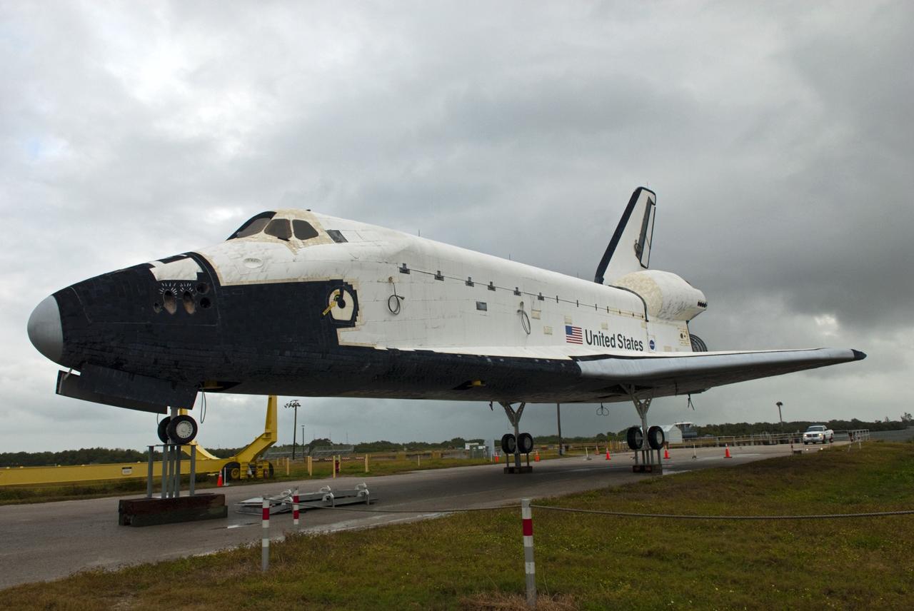 CAPE CANAVERAL, Fla. – Wheels are installed on the high-fidelity space shuttle model following its arrival at Kennedy's Launch Complex 39 turn basin in Florida.  The model was on display at the NASA Kennedy Space Center Visitor Complex until recently. The slip for the barge is in the background at right, behind the model.    The shuttle was part of a display at the visitor complex that also included an external tank and two solid rocket boosters that were used to show visitors the size of actual space shuttle components. The full-scale shuttle model is being transferred from Kennedy to Space Center Houston, NASA Johnson Space Center's visitor center. The model will stay at the turn basin for a few months until it is ready to be transported to Texas via barge. The move also helps clear the way for the Kennedy Space Center Visitor Complex to begin construction of a new facility next year to display space shuttle Atlantis in 2013.  For more information about Space Center Houston, visit http://www.spacecenter.org.  Photo credit: NASA/Jim Grossmann