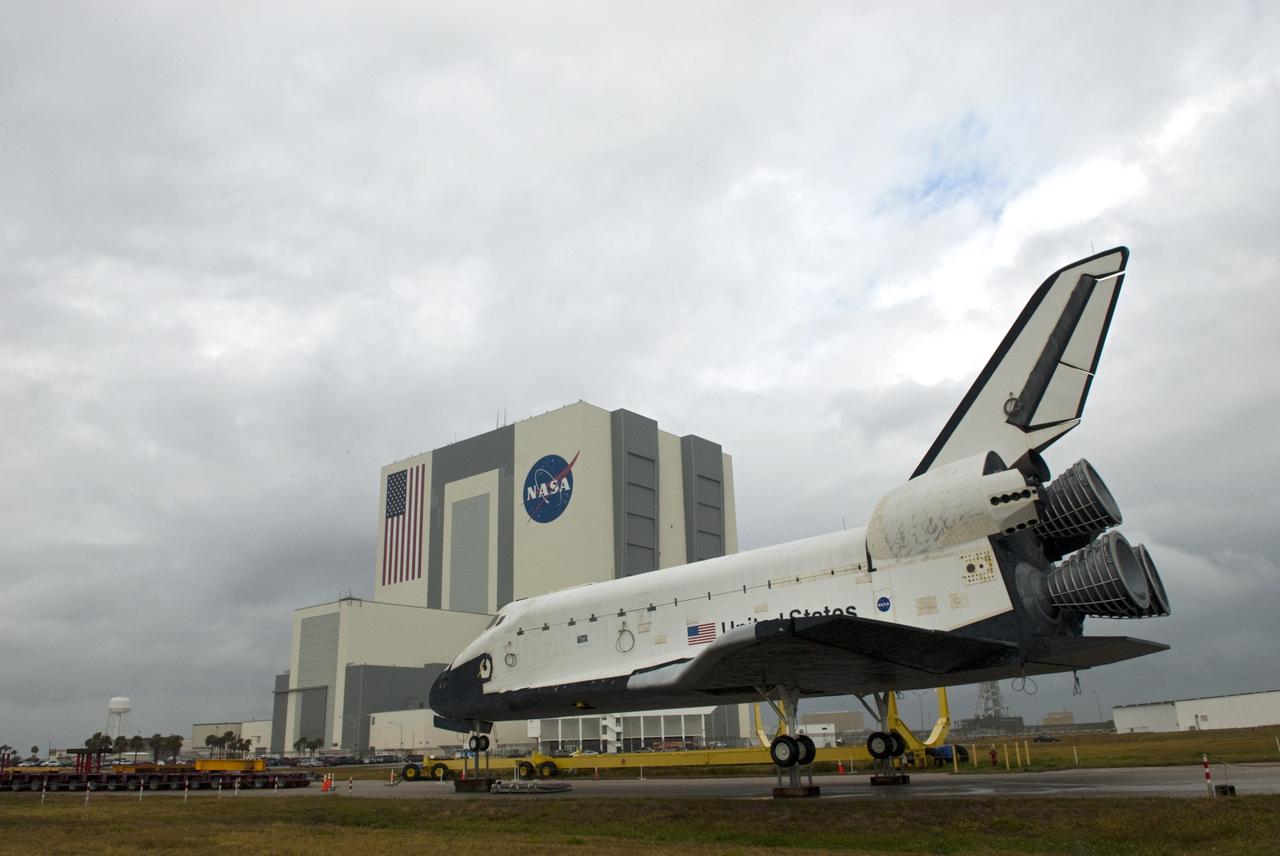 CAPE CANAVERAL, Fla. – The high-fidelity space shuttle model which was on display at the NASA Kennedy Space Center Visitor Complex in Florida has arrived at Kennedy's Launch Complex 39 turn basin and awaits preparation for the next leg of its journey.  Across the street, the Vehicle Assembly Building towers 525 feet into the sky.    The shuttle was part of a display at the visitor complex that also included an external tank and two solid rocket boosters that were used to show visitors the size of actual space shuttle components. The full-scale shuttle model is being transferred from Kennedy to Space Center Houston, NASA Johnson Space Center's visitor center. The model will stay at the turn basin for a few months until it is ready to be transported to Texas via barge. The move also helps clear the way for the Kennedy Space Center Visitor Complex to begin construction of a new facility next year to display space shuttle Atlantis in 2013.  For more information about Space Center Houston, visit http://www.spacecenter.org.  Photo credit: NASA/Jim Grossmann