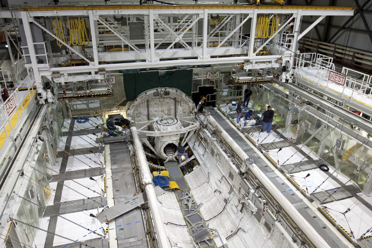 CAPE CANAVERAL, Fla. – Inside Orbiter Processing Facility-2 at NASA’s Kennedy Space Center in Florida, space shuttle Atlantis’ three fuel cells are being removed from the payload bay.    The fuel cells will be drained of all fluids. The hydrogen and oxygen dewars which feed reactants to the fuel cells remain in Atlantis’ mid-body and will be purged with inert gases and vented down. The work is part of the Space Shuttle Program’s transition and retirement processing of shuttle Atlantis. The orbiter is being prepared for display at the Kennedy Space Center Visitor Complex.  Photo credit: NASA/Kim Shiflett