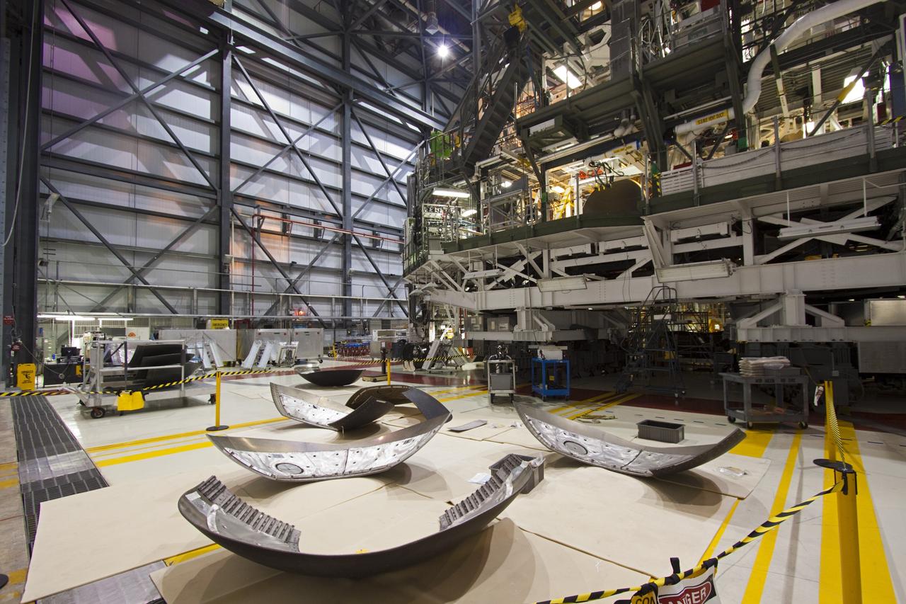 CAPE CANAVERAL, Fla. – Inside Orbiter Processing Facility-1 at NASA’s Kennedy Space Center in Florida, the eyelids and heat shields are being prepared for installation on space shuttle Discovery’s replica shuttle main engines. The heat shields are composed of two, semi-circle-shaped sections of thermal protection system tiles that surround the engines. The work is part of the Space Shuttle Program’s transition and retirement processing of shuttle Discovery. Discovery is being prepared for display at the Smithsonian’s National Air and Space Museum, Steven F. Udvar-Hazy Center in Chantilly, Va. For more information, visit http://www.nasa.gov/shuttle. Photo credit: NASA/Jim Grossmann