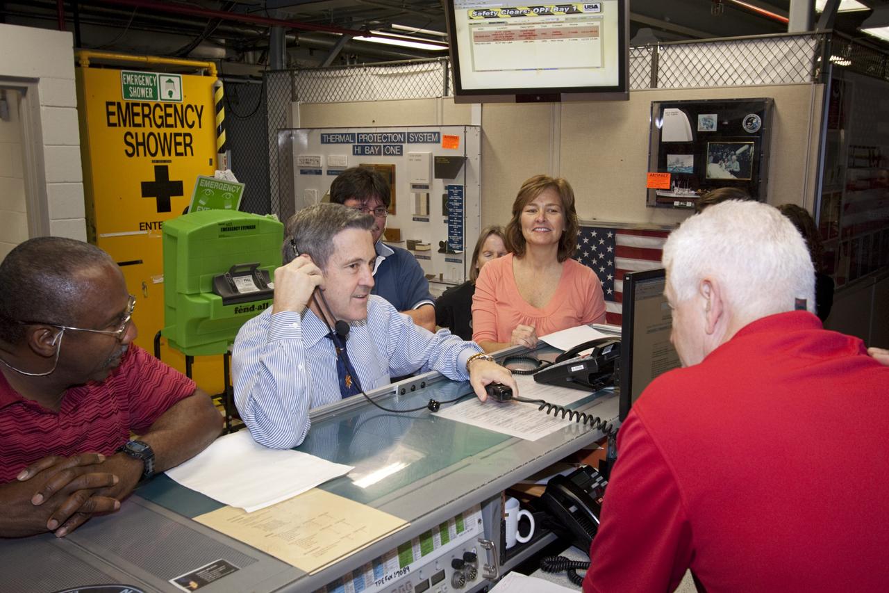 CAPE CANAVERAL, Fla. – In Orbiter Processing Facility-1 at NASA's Kennedy Space Center in Florida, Center Director Robert Cabana (center) is on hand for the final power down of space shuttle Discovery during Space Shuttle Program transition and retirement activities. "Power down" follows the final closure of Discovery's payload bay doors. Discovery is being prepared for public display at the Smithsonian’s National Air and Space Museum Steven F. Udvar-Hazy Center in Chantilly, Va., in 2012. For more information, visit http://www.nasa.gov/shuttle. Photo credit: NASA/Jim Grossmann