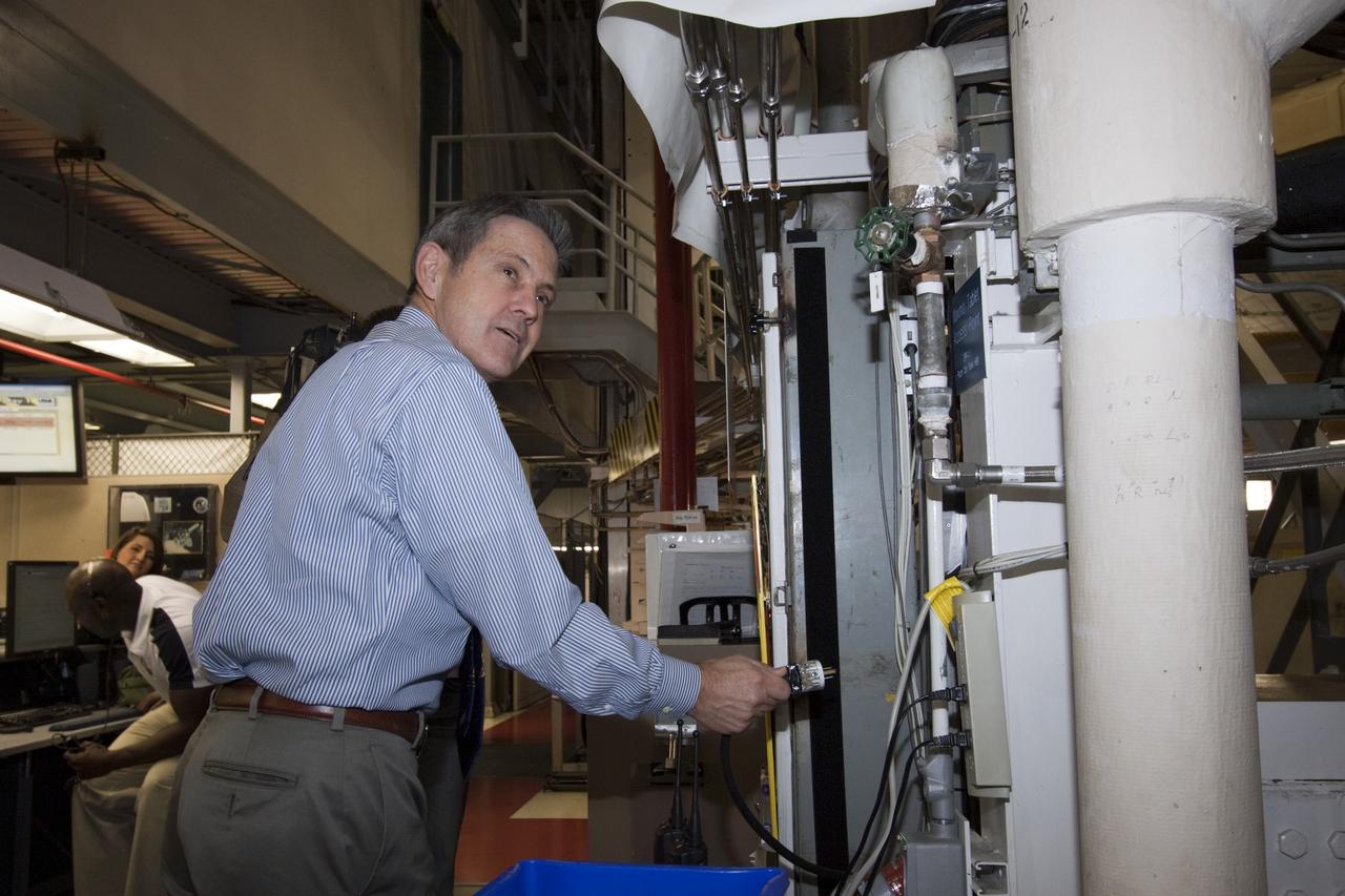 CAPE CANAVERAL, Fla. – In Orbiter Processing Facility-1 at NASA's Kennedy Space Center in Florida, Center Director Robert Cabana participates in the final power down of space shuttle Discovery during Space Shuttle Program transition and retirement activities. "Power down" follows the final closure of Discovery's payload bay doors. Discovery is being prepared for public display at the Smithsonian’s National Air and Space Museum Steven F. Udvar-Hazy Center in Chantilly, Va., in 2012. For more information, visit http://www.nasa.gov/shuttle. Photo credit: NASA/Jim Grossmann