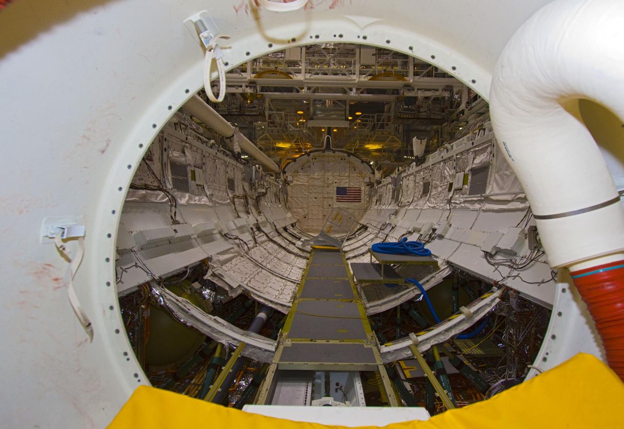 CAPE CANAVERAL, Fla. – In Orbiter Processing Facility-2 at NASA's Kennedy Space Center in Florida, space shuttle Atlantis' payload bay is seen from the airlock on the mid-deck.  Preparations to power down the shuttle for the last time are under way during Space Shuttle Program transition and retirement activities. Atlantis is being prepared for public display in 2013 at the Kennedy Space Center Visitor Complex.  For more information, visit http://www.nasa.gov/shuttle.  Photo credit: NASA/Jim Grossmann