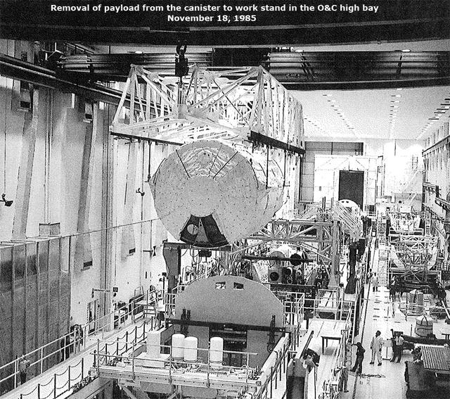 Removal of payload from the canister to work stand in the O&C high bay, November 18, 1985
