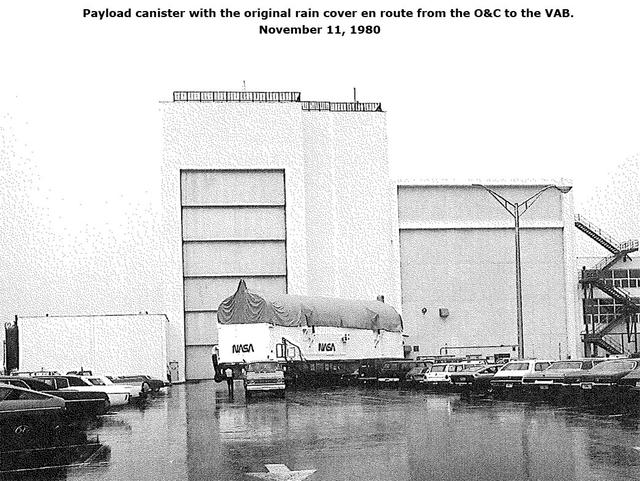 Payload canister with the original rain cover en route from the O&C to the VAB, November 11, 1980