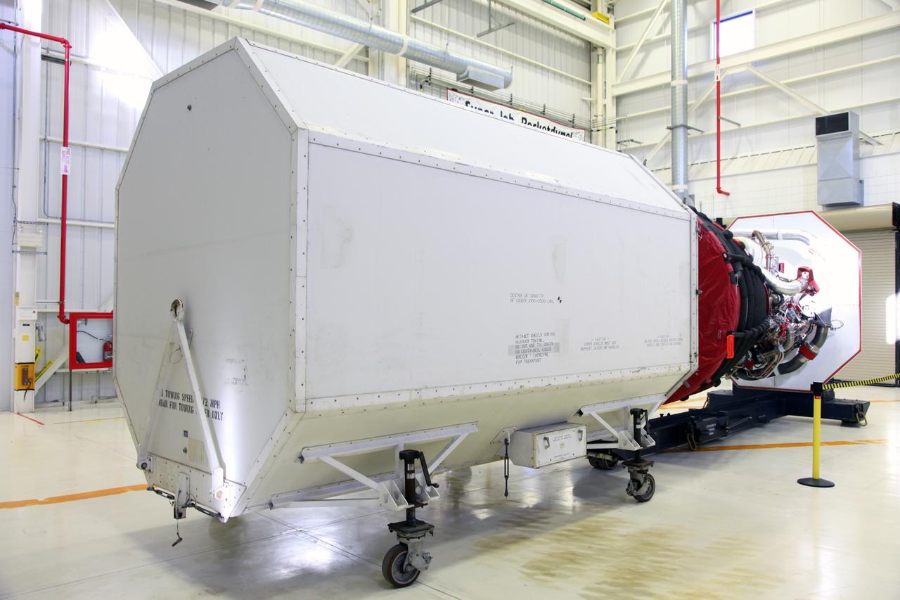 CAPE CANAVERAL, Fla. – In the Space Shuttle Main Engine Processing Facility at NASA’s Kennedy Space Center in Florida, a Pratt Whitney Rocketdyne space shuttle main engine (SSME) is installed in a transportation canister.    This is the second of the 15 engines used during the Space Shuttle Program to be prepared for transfer to NASA's Stennis Space Center in Mississippi. The engines will be stored at Stennis for future use on NASA's new heavy-lift rocket, the Space Launch System (SLS), which will carry NASA's new Orion spacecraft, cargo, equipment and science experiments to space.  For more information, visit http://www.nasa.gov/shuttle.  Photo credit: NASA/Gianni Woods