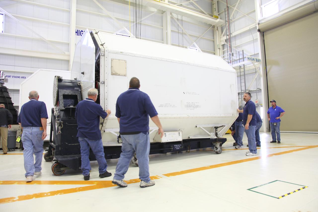 CAPE CANAVERAL, Fla. – In the Space Shuttle Main Engine Processing Facility at NASA’s Kennedy Space Center in Florida, a transportation canister is nearly closed around a Pratt Whitney Rocketdyne space shuttle main engine (SSME).    This is the second of the 15 engines used during the Space Shuttle Program to be prepared for transfer to NASA's Stennis Space Center in Mississippi. The engines will be stored at Stennis for future use on NASA's new heavy-lift rocket, the Space Launch System (SLS), which will carry NASA's new Orion spacecraft, cargo, equipment and science experiments to space.  For more information, visit http://www.nasa.gov/shuttle.  Photo credit: NASA/Gianni Woods