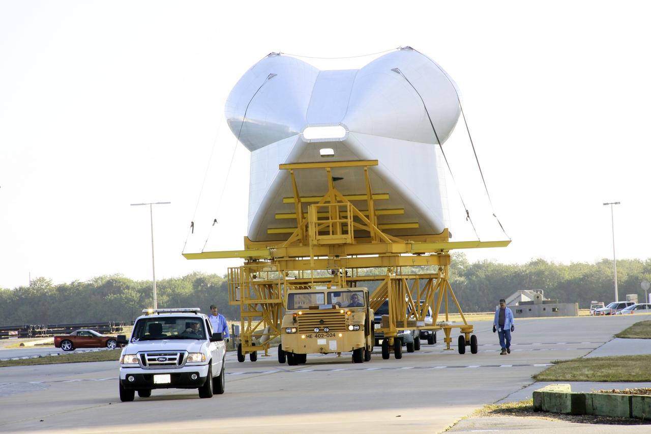 CAPE CANAVERAL, Fla. -- The tail cone for space shuttle Discovery’s three replica shuttle main engines (RSMEs) is being transported to Orbiter processing Facility-1 at NASA’s Kennedy Space Center in Florida. The tail cone will be installed around Discovery’s RSMEs for protection. The work is part of the Space Shuttle Program’s transition and retirement processing of shuttle Discovery. Discovery is being prepared for display at the Smithsonian’s National Air and Space Museum, Steven F. Udvar-Hazy Center in Chantilly, Va. For more information, visit http://www.nasa.gov/shuttle. Photo credit: NASA/Jim Grossmann
