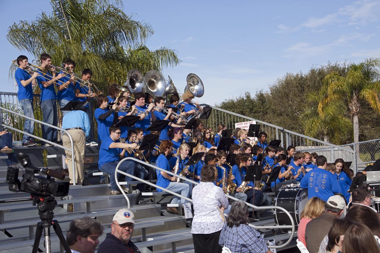 CAPE CANAVERAL, Fla. – In the Shuttle Plaza area at the Kennedy Space Center Visitor Complex in Florida, members of the Titusville High School marching band play music before the start of a Ground Breaking Ceremony for the future home of space shuttle Atlantis.    Delaware North Parks & Resorts, in partnership with NASA’s Kennedy Space Center, broke ground for the 65,000 square-foot exhibit that will house Atlantis at the visitor complex. For more information, visit www.KennedySpaceCenter.com.  Photo credit: NASA/Jim Grossmann