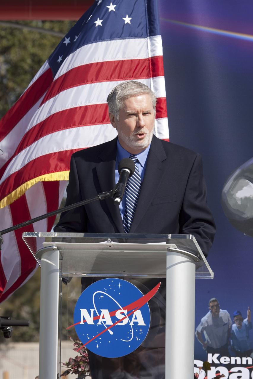 CAPE CANAVERAL, Fla. – In the Shuttle Plaza area at the Kennedy Space Center Visitor Complex (KSCVC) in Florida, KSCVC Chief Operating Officer Bill Moore speaks during the Ground Breaking Ceremony for the future home of space shuttle Atlantis.    Delaware North Parks & Resorts, in partnership with NASA’s Kennedy Space Center, broke ground for the 65,000 square-foot exhibit that will house Atlantis at the visitor complex. For more information, visit www.KennedySpaceCenter.com.  Photo credit: NASA/Jim Grossmann