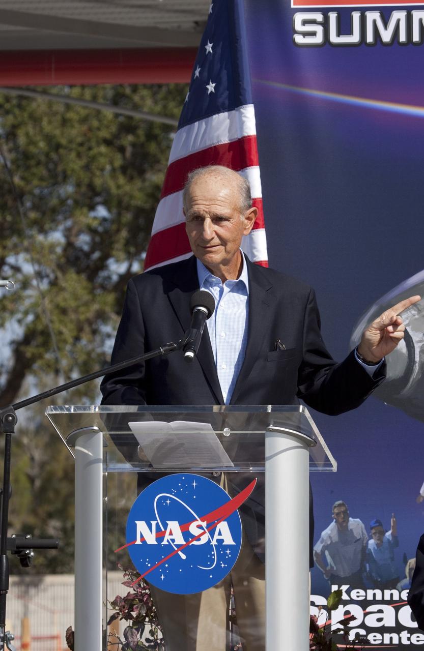 CAPE CANAVERAL, Fla. – In the Shuttle Plaza area at the Kennedy Space Center Visitor Complex in Florida, Jeremy Jacobs, chairman and chief executive officer of Delaware North Companies, speaks during the Ground Breaking Ceremony for the future home of space shuttle Atlantis.    Delaware North Parks & Resorts, in partnership with NASA’s Kennedy Space Center, broke ground for the 65,000 square-foot exhibit that will house Atlantis at the visitor complex. For more information, visit www.KennedySpaceCenter.com.  Photo credit: NASA/Jim Grossmann