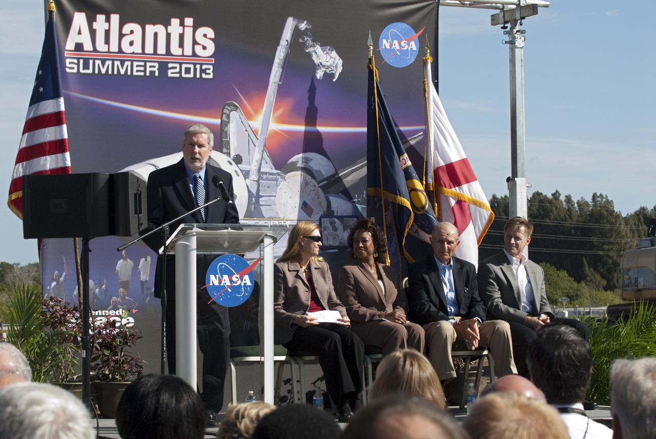 CAPE CANAVERAL, Fla. – In the Shuttle Plaza area at the Kennedy Space Center Visitor Complex in Florida, Chief Operating Officer Bill Moore speaks during a Ground Breaking Ceremony for the future home of space shuttle Atlantis. Seated at right, are Kennedy Space Center Deputy Director Janet Petro; Lt. Governor of Florida Jennifer Carroll; Jeremy Jacobs, chairman and chief executive officer of Delaware North Companies; and STS-135 Commander Chris Ferguson.    Delaware North Parks & Resorts, in partnership with NASA’s Kennedy Space Center, broke ground for the 65,000 square-foot exhibit that will house Atlantis at the visitor complex. For more information, visit www.KennedySpaceCenter.com.  Photo credit: NASA/Kim Shiflett