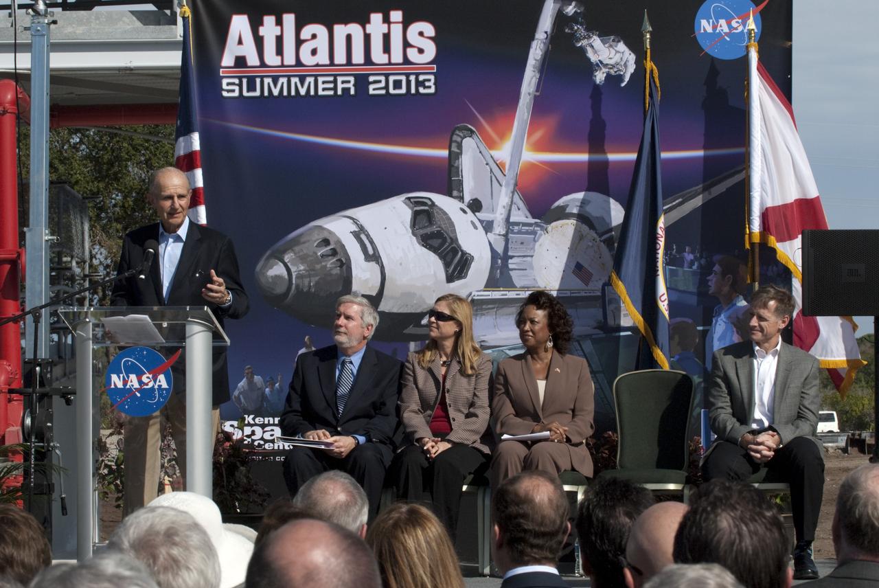 CAPE CANAVERAL, Fla. – In the Shuttle Plaza area at the Kennedy Space Center Visitor Complex (KSCVC) in Florida, Jeremy Jacobs, chairman and chief executive officer of Delaware North Companies, speaks during the Ground Breaking Ceremony for the future home of space shuttle Atlantis. Seated at right, are KSCVC Chief Operating Officer Bill Moore; Kennedy Space Center Deputy Director Janet Petro; Lt. Governor of Florida Jennifer Carroll; and STS-135 Commander Chris Ferguson.      Delaware North Parks & Resorts, in partnership with NASA’s Kennedy Space Center, broke ground for the 65,000 square-foot exhibit that will house Atlantis at the visitor complex. For more information, visit www.KennedySpaceCenter.com.  Photo credit: NASA/Kim Shiflett
