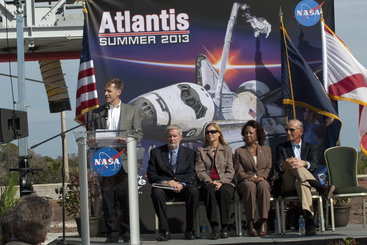 CAPE CANAVERAL, Fla. – In the Shuttle Plaza area at the Kennedy Space Center Visitor Complex (KSCVC) in Florida, STS-135 Commander Chris Ferguson speaks during the Ground Breaking Ceremony for the future home of space shuttle Atlantis. Seated at right, are KSCVC Chief Operating Officer Bill Moore; Kennedy Space Center Deputy Director Janet Petro; Lt. Governor of Florida Jennifer Carroll; and Jeremy Jacobs, chairman and chief executive officer of Delaware North Companies.     Delaware North Parks & Resorts, in partnership with NASA’s Kennedy Space Center, broke ground for the 65,000 square-foot exhibit that will house Atlantis at the visitor complex. For more information, visit www.KennedySpaceCenter.com.  Photo credit: NASA/Kim Shiflett