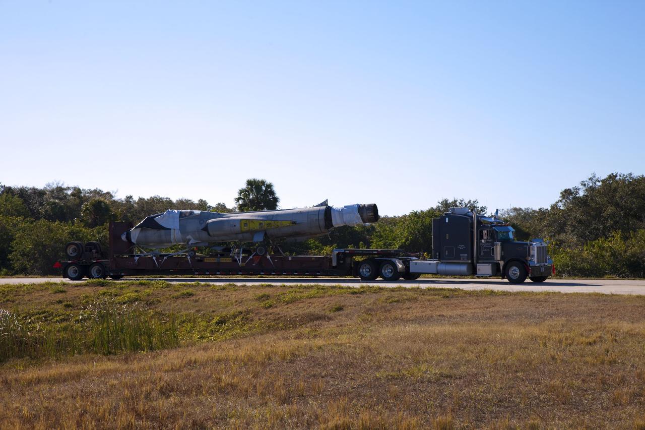 CAPE CANAVERAL, Fla. -- A truck delivers an F-104 Starfighter, formerly of the Italian Air Force, to Starfighters Inc. at NASA's Kennedy Space Center in Florida on Jan. 19, 2012. The aircraft is one of five delivered to the company recently. They will be reassembled to fly research and development and other missions. Starfighters operates out of a hangar at the Shuttle Landing Facility at Kennedy under an agreement with Kennedy. Photo credit: NASA/Frankie Martin