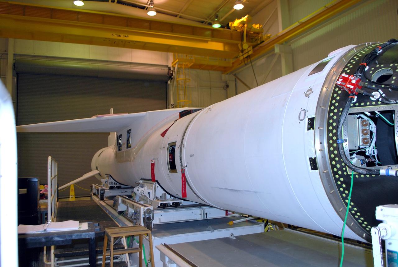 VANDENBERG AIR FORCE BASE, Calif. -- Preparations for the second flight simulation of an Orbital Sciences Corp. Pegasus rocket are under way in processing facility 1555 at Vandenberg Air Force Base (VAFB) in California. The rocket is being prepared to launch NASA's Nuclear Spectroscopic Telescope Array (NuSTAR) into space. After the rocket and spacecraft are processed at Vandenberg, they will be flown on the Orbital Sciences' L-1011 carrier aircraft to the Ronald Reagan Ballistic Missile Defense Test Site at the Pacific Ocean's Kwajalein Atoll for launch, targeted for no earlier than March 14. The high-energy x-ray telescope will conduct a census for black holes, map radioactive material in young supernovae remnants, and study the origins of cosmic rays and the extreme physics around collapsed stars. For more information, visit http://www.nasa.gov/nustar. Photo credit: NASA/Randy Beaudoin, VAFB