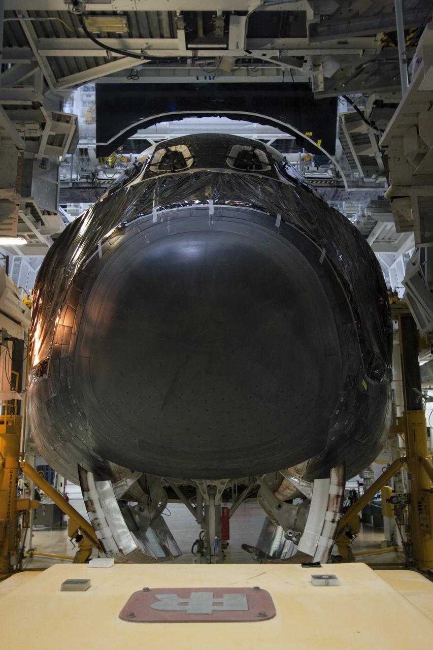 CAPE CANAVERAL, Fla. -- Protective plastic flanks the nose of space shuttle Atlantis for its move from Orbiter Processing Facility-2 to the Vehicle Assembly Building (VAB) at NASA's Kennedy Space Center in Florida. Atlantis will be stored temporarily in the VAB while transition and retirement processing resumes on shuttle Endeavour in the processing hangar. Endeavour is being prepared for public display at the California Science Center in Los Angeles. A groundbreaking was held Jan. 18 for Atlantis' future home -- a 65,000-square-foot exhibit in Shuttle Plaza at the Kennedy Space Center Visitor Complex. For additional information, visit http://www.nasa.gov/shuttle. Photo credit: NASA/Jim Grossmann