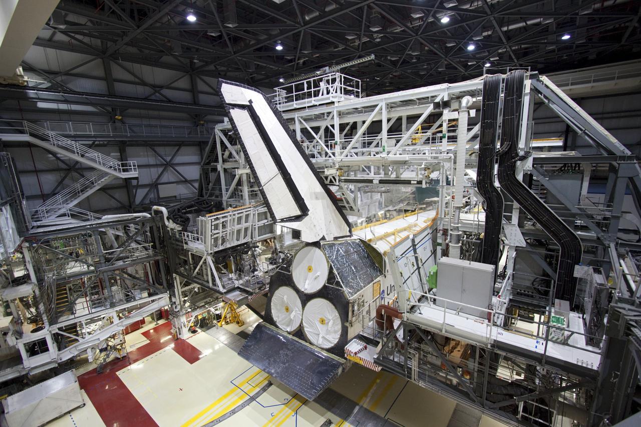 CAPE CANAVERAL, Fla. -- Preparations are under way to back space shuttle Atlantis out from under the work platforms in Orbiter Processing Facility-2 for its move to the Vehicle Assembly Building (VAB) at NASA's Kennedy Space Center in Florida. Atlantis will be stored temporarily in the VAB while transition and retirement processing resumes on shuttle Endeavour in the processing hangar. Endeavour is being prepared for public display at the California Science Center in Los Angeles. A groundbreaking was held Jan. 18 for Atlantis' future home -- a 65,000-square-foot exhibit in Shuttle Plaza at the Kennedy Space Center Visitor Complex. For additional information, visit http://www.nasa.gov/shuttle. Photo credit: NASA/Jim Grossmann