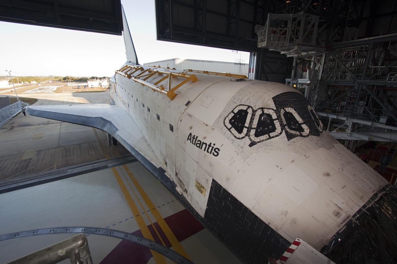 CAPE CANAVERAL, Fla. -- The tail fin of space shuttle Atlantis emerges through the open door of Orbiter Processing Facility-2 on its move to the Vehicle Assembly Building (VAB) at NASA's Kennedy Space Center in Florida. Atlantis will be stored temporarily in the VAB while transition and retirement processing resumes on shuttle Endeavour in the processing hangar. Endeavour is being prepared for public display at the California Science Center in Los Angeles. A groundbreaking was held Jan. 18 for Atlantis' future home -- a 65,000-square-foot exhibit in Shuttle Plaza at the Kennedy Space Center Visitor Complex. For additional information, visit http://www.nasa.gov/shuttle. Photo credit: NASA/Jim Grossmann