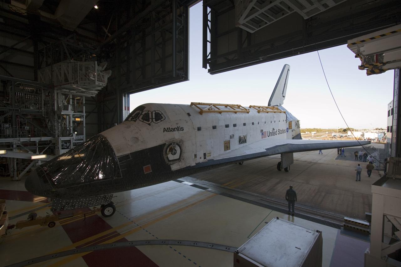 CAPE CANAVERAL, Fla. -- Space shuttle Atlantis backs through the open door of Orbiter Processing Facility-2 on its move to the Vehicle Assembly Building (VAB) at NASA's Kennedy Space Center in Florida. Atlantis will be stored temporarily in the VAB while transition and retirement processing resumes on shuttle Endeavour in the processing hangar. Endeavour is being prepared for public display at the California Science Center in Los Angeles. A groundbreaking was held Jan. 18 for Atlantis' future home -- a 65,000-square-foot exhibit in Shuttle Plaza at the Kennedy Space Center Visitor Complex. For additional information, visit http://www.nasa.gov/shuttle. Photo credit: NASA/Jim Grossmann