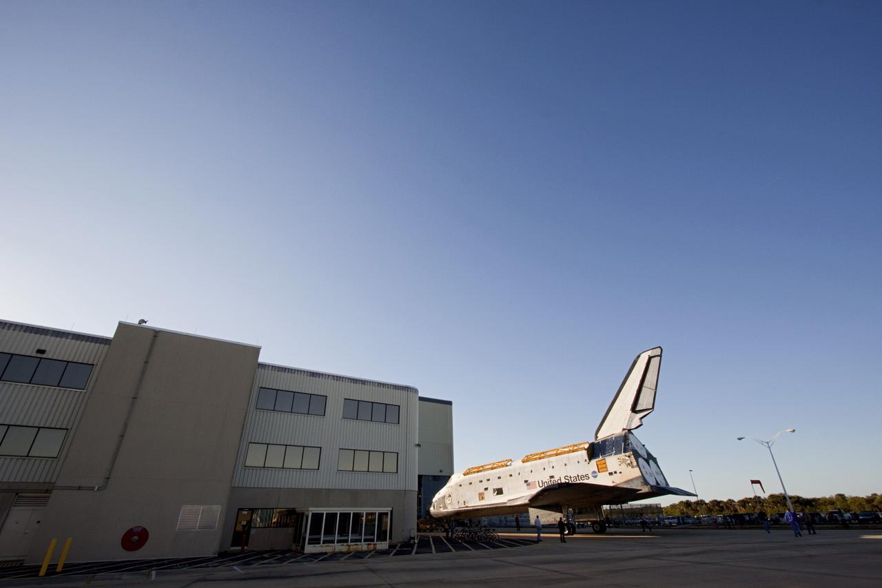 CAPE CANAVERAL, Fla. -- Space shuttle Atlantis basks in the sunshine outside Orbiter Processing Facility-2 on its move to the Vehicle Assembly Building (VAB) at NASA's Kennedy Space Center in Florida. Atlantis will be stored temporarily in the VAB while transition and retirement processing resumes on shuttle Endeavour in the processing hangar. Endeavour is being prepared for public display at the California Science Center in Los Angeles. A groundbreaking was held Jan. 18 for Atlantis' future home -- a 65,000-square-foot exhibit in Shuttle Plaza at the Kennedy Space Center Visitor Complex. For additional information, visit http://www.nasa.gov/shuttle. Photo credit: NASA/Jim Grossmann