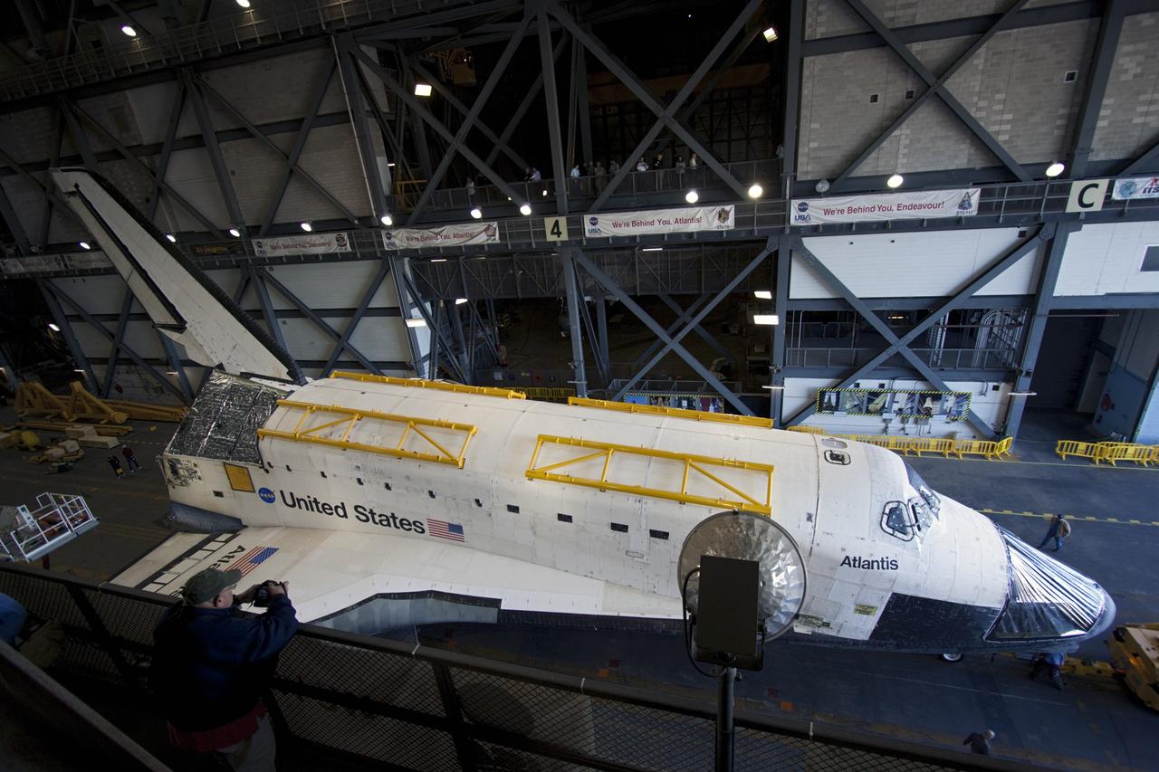 CAPE CANAVERAL, Fla. -- Space shuttle Atlantis rolls to a stop in the transfer aisle of the Vehicle Assembly Building (VAB) at NASA's Kennedy Space Center in Florida, following its move from Orbiter Processing Facility-2. Atlantis will be stored temporarily in the VAB while transition and retirement processing resumes on shuttle Endeavour in the processing hangar. Endeavour is being prepared for public display at the California Science Center in Los Angeles. A groundbreaking was held Jan. 18 for Atlantis' future home -- a 65,000-square-foot exhibit in Shuttle Plaza at the Kennedy Space Center Visitor Complex. For additional information, visit http://www.nasa.gov/shuttle. Photo credit: NASA/Jim Grossmann