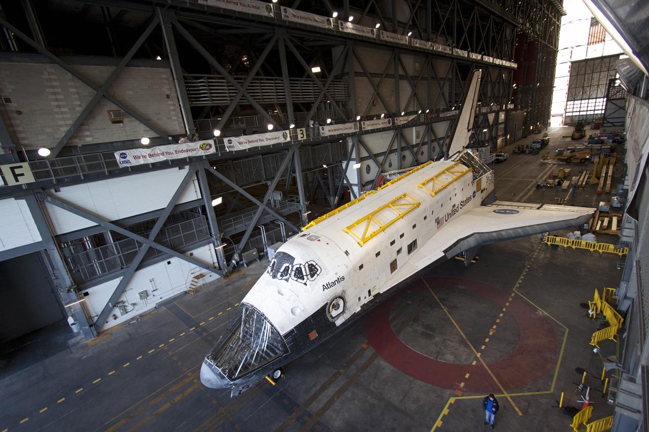 CAPE CANAVERAL, Fla. -- Space shuttle Atlantis is parked in the transfer aisle of the Vehicle Assembly Building (VAB) at NASA's Kennedy Space Center in Florida, following its move from Orbiter Processing Facility-2. Atlantis will be stored temporarily in the VAB while transition and retirement processing resumes on shuttle Endeavour in the processing hangar. Endeavour is being prepared for public display at the California Science Center in Los Angeles. A groundbreaking was held Jan. 18 for Atlantis' future home -- a 65,000-square-foot exhibit in Shuttle Plaza at the Kennedy Space Center Visitor Complex. For additional information, visit http://www.nasa.gov/shuttle. Photo credit: NASA/Jim Grossmann