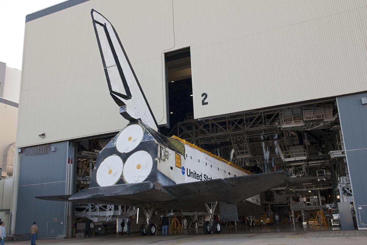 CAPE CANAVERAL, Fla. -- Space shuttle Atlantis backs through the open door of Orbiter Processing Facility-2 on its move to the Vehicle Assembly Building (VAB) at NASA's Kennedy Space Center in Florida. Atlantis will be stored temporarily in the VAB while transition and retirement processing resumes on shuttle Endeavour in the processing hangar. Endeavour is being prepared for public display at the California Science Center in Los Angeles. A groundbreaking was held Jan. 18 for Atlantis' future home -- a 65,000-square-foot exhibit in Shuttle Plaza at the Kennedy Space Center Visitor Complex. For additional information, visit http://www.nasa.gov/shuttle. Photo credit: NASA/Charisse Nahser