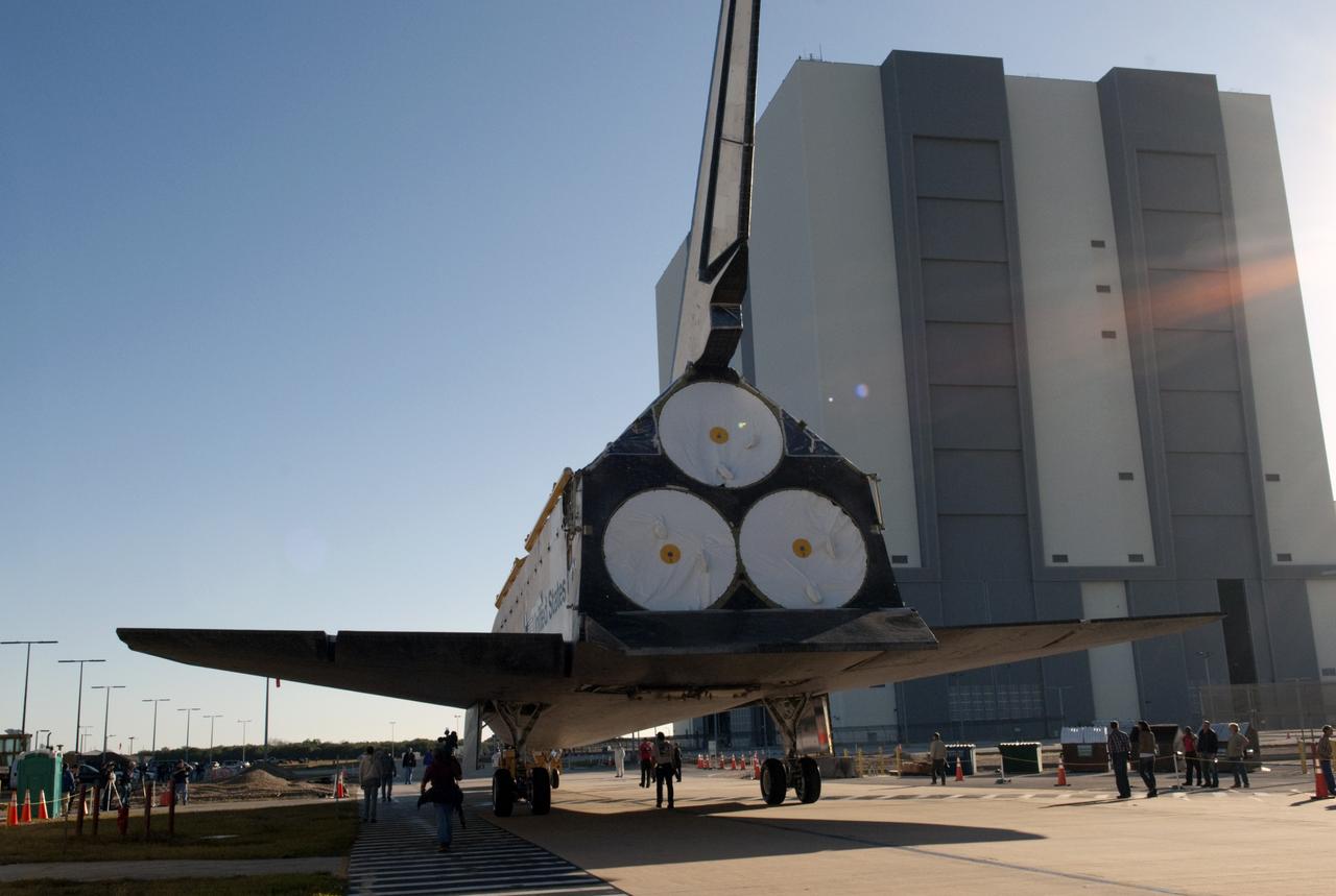 CAPE CANAVERAL, Fla. -- Space shuttle Atlantis casts a wide shadow as it approaches the 525-foot-tall Vehicle Assembly Building (VAB) at NASA's Kennedy Space Center in Florida on its move from Orbiter Processing Facility-2. Atlantis will be stored temporarily in the VAB while transition and retirement processing resumes on shuttle Endeavour in the processing hangar. Endeavour is being prepared for public display at the California Science Center in Los Angeles. A groundbreaking was held Jan. 18 for Atlantis' future home -- a 65,000-square-foot exhibit in Shuttle Plaza at the Kennedy Space Center Visitor Complex. For additional information, visit http://www.nasa.gov/shuttle. Photo credit: NASA/Charisse Nahser