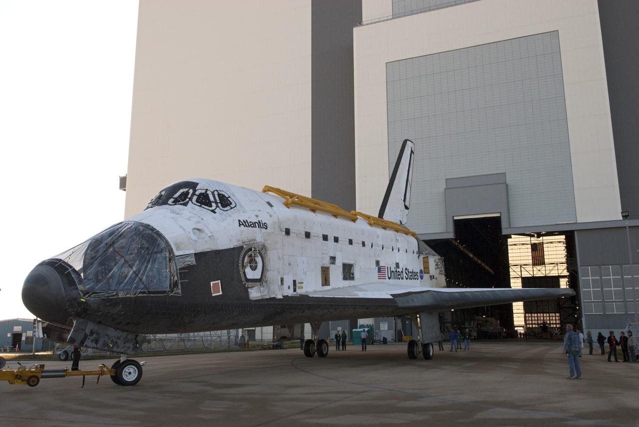 CAPE CANAVERAL, Fla. -- Space shuttle Atlantis backs toward the open door of the transfer aisle of the 525-foot-tall Vehicle Assembly Building (VAB) at NASA's Kennedy Space Center in Florida. Atlantis is being moved to the VAB from Orbiter Processing Facility-2. Atlantis will be stored temporarily in the VAB while transition and retirement processing resumes on shuttle Endeavour in the processing hangar. Endeavour is being prepared for public display at the California Science Center in Los Angeles. A groundbreaking was held Jan. 18 for Atlantis' future home -- a 65,000-square-foot exhibit in Shuttle Plaza at the Kennedy Space Center Visitor Complex. For additional information, visit http://www.nasa.gov/shuttle. Photo credit: NASA/Charisse Nahser