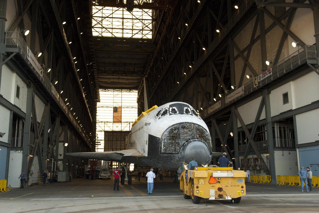 CAPE CANAVERAL, Fla. -- Space shuttle Atlantis backs into the transfer aisle of the Vehicle Assembly Building (VAB) at NASA's Kennedy Space Center in Florida on its move from Orbiter Processing Facility-2. Atlantis will be stored temporarily in the VAB while transition and retirement processing resumes on shuttle Endeavour in the processing hangar. Endeavour is being prepared for public display at the California Science Center in Los Angeles. A groundbreaking was held Jan. 18 for Atlantis' future home -- a 65,000-square-foot exhibit in Shuttle Plaza at the Kennedy Space Center Visitor Complex. For additional information, visit http://www.nasa.gov/shuttle. Photo credit: NASA/Charisse Nahser