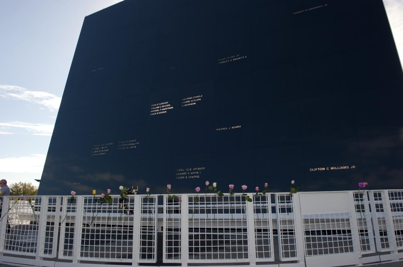 CAPE CANAVERAL, Fla. -- Roses decorate the fence surrounding the Space Mirror Memorial at the Kennedy Space Center Visitor Complex in Florida during Kennedy Space Center’s NASA Day of Remembrance. A large wreath was placed at the memorial by Kennedy Center Director Robert Cabana, Deputy Director Janet Petro, and United Space Alliance’s Vice President for Aerospace Services/Florida Site Director Mark Nappi. The Day of Remembrance honors members of the NASA family who lost their lives while furthering the cause of exploration and discovery, including the astronaut crews of Apollo 1 and space shuttles Challenger and Columbia. Kennedy civil service and contractor employees, along with the general public, paid their respects throughout the day. The visitor complex provided flowers for visitors to place at the memorial. Photo credit: NASA/Kim Shiflett