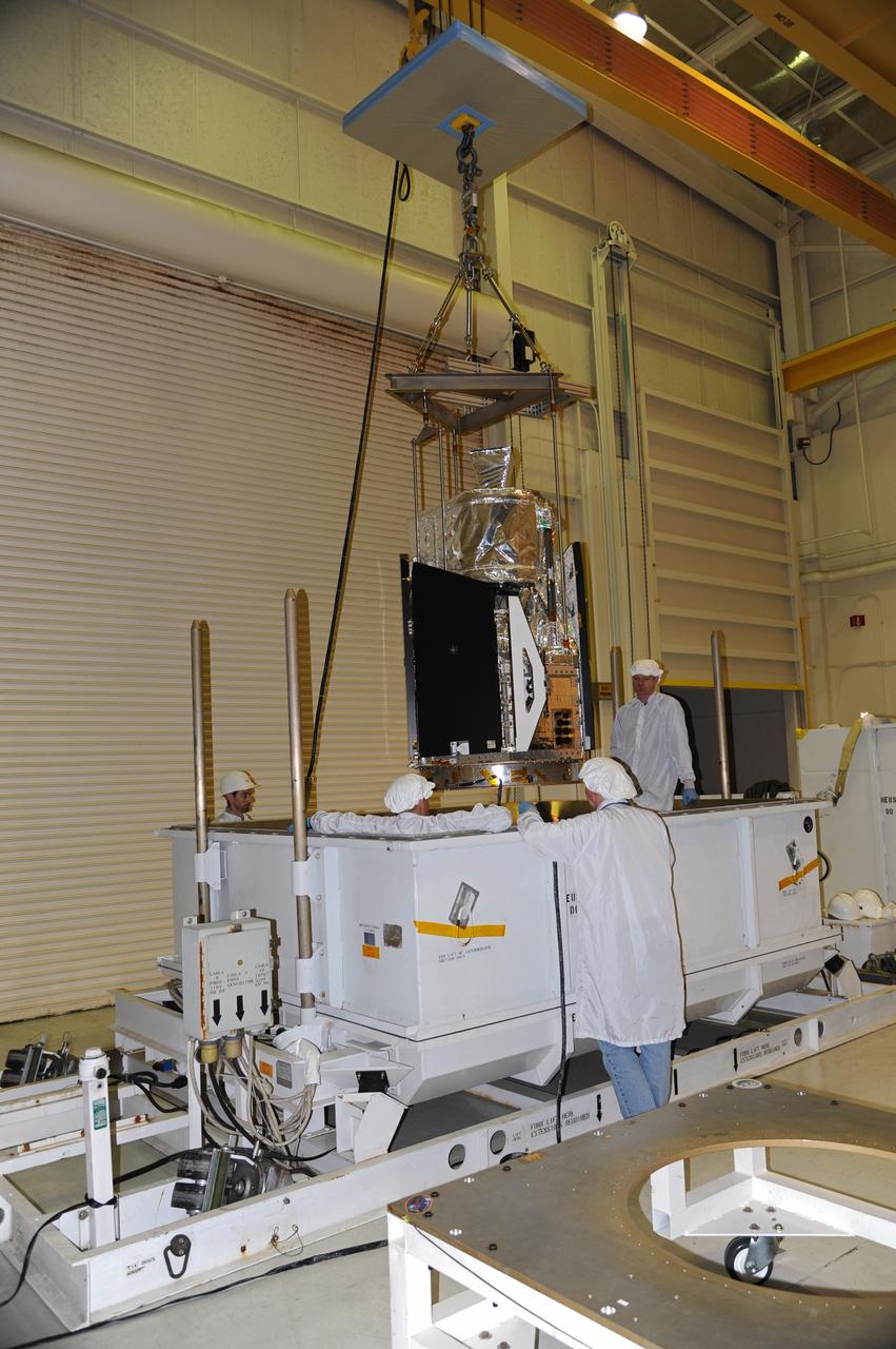 VANDENBERG AIR FORCE BASE, Calif. -- In the airlock of processing facility 1555 at Vandenberg Air Force Base (VAFB) in California, a lifting fixture is employed to hoist NASA's Nuclear Spectroscopic Telescope Array (NuSTAR) from its shipping container. The spacecraft arrived at VAFB Jan. 27 after a cross-country trip which began from Orbital Sciences' manufacturing plant in Dulles, Va., on Jan. 24. Next, NuSTAR will be transferred from the airlock into the processing hangar, joining the Pegasus XL rocket that is set to carry it to space. After checkout and other processing activities are complete, the spacecraft will be integrated with the Pegasus in mid-February and encapsulation in the vehicle fairing will follow. The rocket and spacecraft then will be flown on Orbital's L-1011 carrier aircraft to the Ronald Reagan Ballistic Missile Defense Test Site at the Pacific Ocean's Kwajalein Atoll for launch in March. The high-energy X-ray telescope will conduct a census for black holes, map radioactive material in young supernovae remnants, and study the origins of cosmic rays and the extreme physics around collapsed stars. For more information, visit http://www.nasa.gov/nustar. Photo credit: NASA/Randy Beaudoin, VAFB