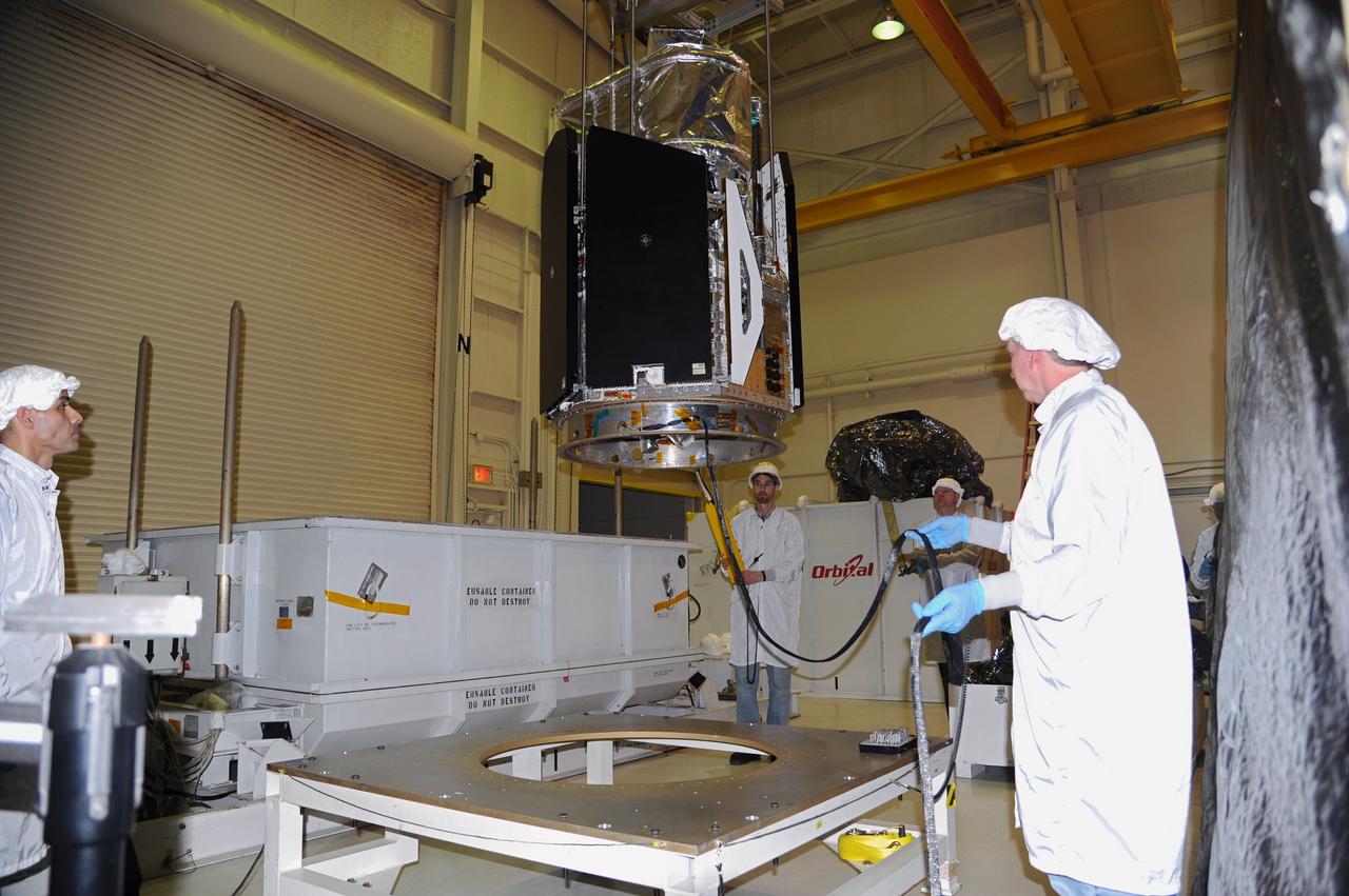 VANDENBERG AIR FORCE BASE, Calif. -- In the airlock of processing facility 1555 at Vandenberg Air Force Base (VAFB) in California, NASA's Nuclear Spectroscopic Telescope Array (NuSTAR) moves slowly toward a handling dolly. The spacecraft arrived at VAFB Jan. 27 after a cross-country trip which began from Orbital Sciences' manufacturing plant in Dulles, Va., on Jan. 24. Next, NuSTAR will be transferred from the airlock into the processing hangar, joining the Pegasus XL rocket that is set to carry it to space. After checkout and other processing activities are complete, the spacecraft will be integrated with the Pegasus in mid-February and encapsulation in the vehicle fairing will follow. The rocket and spacecraft then will be flown on Orbital's L-1011 carrier aircraft to the Ronald Reagan Ballistic Missile Defense Test Site at the Pacific Ocean's Kwajalein Atoll for launch in March. The high-energy X-ray telescope will conduct a census for black holes, map radioactive material in young supernovae remnants, and study the origins of cosmic rays and the extreme physics around collapsed stars. For more information, visit http://www.nasa.gov/nustar. Photo credit: NASA/Randy Beaudoin, VAFB