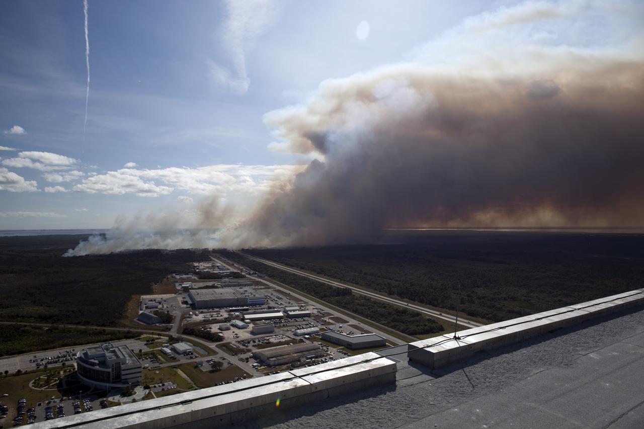 CAPE CANAVERAL, Fla. -- A controlled burn consumes the brush in the vicinity of the Industrial Area at NASA's Kennedy Space Center in Florida.    The burn, managed by the U.S. Fish and Wildlife Service, targeted 2,174 acres near Kennedy's administrative complex. Shifting winds caused the fire to flare up in places to dramatic effect. Limited visibility caused by the smoke required NASA Security to close some roadways. The burn, which began during the 8 o'clock hour this morning, is expected to be extinguished this evening. Controlled burns are commonplace on the center to reduce the likelihood of an unplanned brush fire during Central Florida's dry season. Photo Credit: NASA/Dimitri Gerondidakis