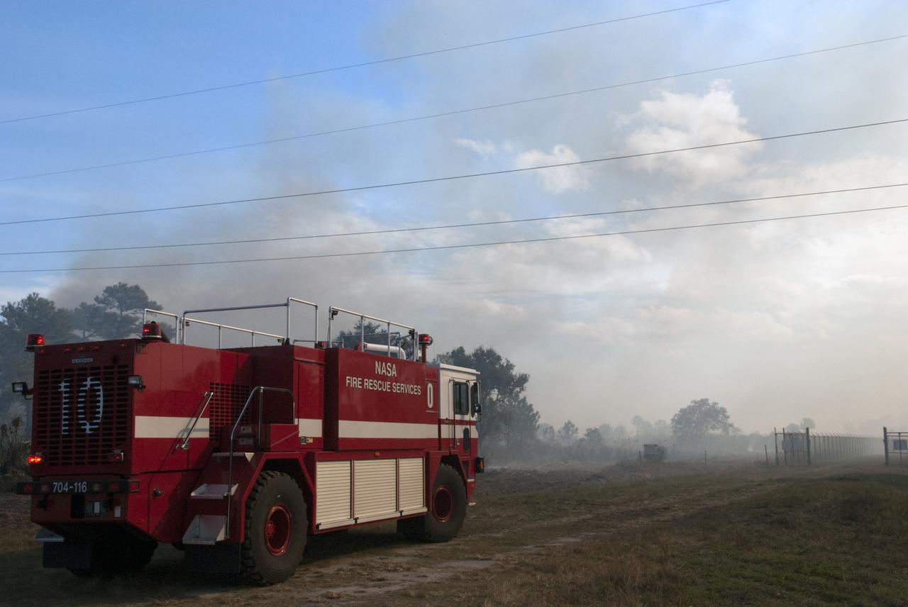 CAPE CANAVERAL, Fla. -- NASA Fire Rescue Services are on the scene to support a controlled burn in the vicinity of the Industrial Area at NASA's Kennedy Space Center in Florida.    The burn, managed by the U.S. Fish and Wildlife Service, targeted 2,174 acres near Kennedy's administrative complex. Shifting winds caused the fire to flare up in places to dramatic effect. Limited visibility caused by the smoke required NASA Security to close some roadways. The burn, which began during the 8 o'clock hour this morning, is expected to be extinguished this evening. Controlled burns are commonplace on the center to reduce the likelihood of an unplanned brush fire during Central Florida's dry season. Photo Credit: NASA/Jim Grossmann