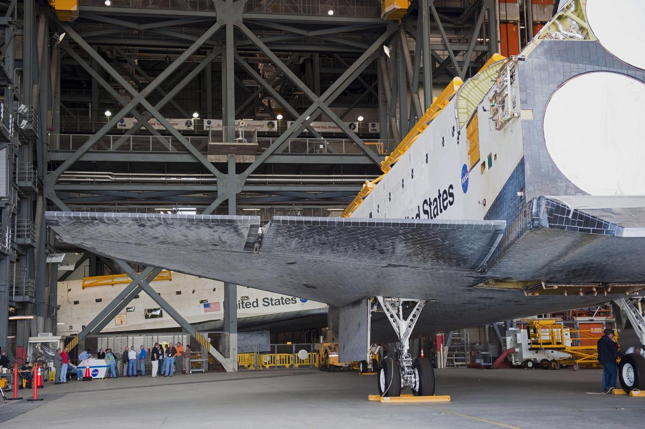 CAPE CANAVERAL, Fla. – Inside the Vehicle Assembly Building at NASA’s Kennedy Space Center in Florida, space shuttle Endeavour is being prepared to be backed out and towed to Orbiter Processing Facility-2 (OPF-2). In the background is space shuttle Atlantis.    Shuttle Endeavour will remain in OPF-2 so that the orbiter maneuvering system (OMS) pods and forward reaction control system can be installed. Technicians also will offload water and Freon gas from lines located in Endeavour’s midbody. The work is part of Endeavour’s transition and retirement processing. The spacecraft is being prepared for public display at the California Science Center in Los Angeles. Endeavour flew 25 missions, spent 299 days in space, orbited Earth 4,671 times and traveled 122, 883, 151 miles over the course of its 19-year career. Endeavour’s STS-134 and final mission was completed after landing on June 1, 2011. Photo credit: Kim Shiflett