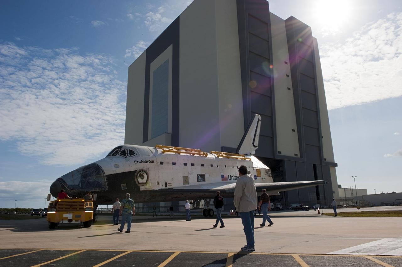 CAPE CANAVERAL, Fla. – At NASA’s Kennedy Space Center in Florida, technicians walk alongside as space shuttle Endeavour is being towed from the Vehicle Assembly Building to Orbiter Processing Facility-2. Shuttle Endeavour will remain in OPF-2 so that the orbiter maneuvering system (OMS) pods and forward reaction control system can be installed. Technicians also will offload water and Freon gas from lines located in Endeavour’s midbody. The work is part of Endeavour’s transition and retirement processing. The spacecraft is being prepared for public display at the California Science Center in Los Angeles. Endeavour flew 25 missions, spent 299 days in space, orbited Earth 4,671 times and traveled 122, 883, 151 miles over the course of its 19-year career. Endeavour’s STS-134 and final mission was completed after landing on June 1, 2011. Photo credit: Kim Shiflett