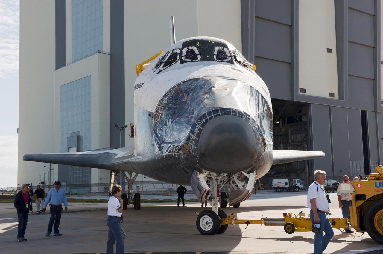 CAPE CANAVERAL, Fla. – At NASA’s Kennedy Space Center in Florida, technicians walk alongside as space shuttle Endeavour is being towed from the Vehicle Assembly Building to Orbiter Processing Facility-2. Shuttle Endeavour will remain in OPF-2 so that the orbiter maneuvering system (OMS) pods and forward reaction control system can be installed. Technicians also will offload water and Freon gas from lines located in Endeavour’s midbody. The work is part of Endeavour’s transition and retirement processing. The spacecraft is being prepared for public display at the California Science Center in Los Angeles. Endeavour flew 25 missions, spent 299 days in space, orbited Earth 4,671 times and traveled 122, 883, 151 miles over the course of its 19-year career. Endeavour’s STS-134 and final mission was completed after landing on June 1, 2011. Photo credit: Kim Shiflett