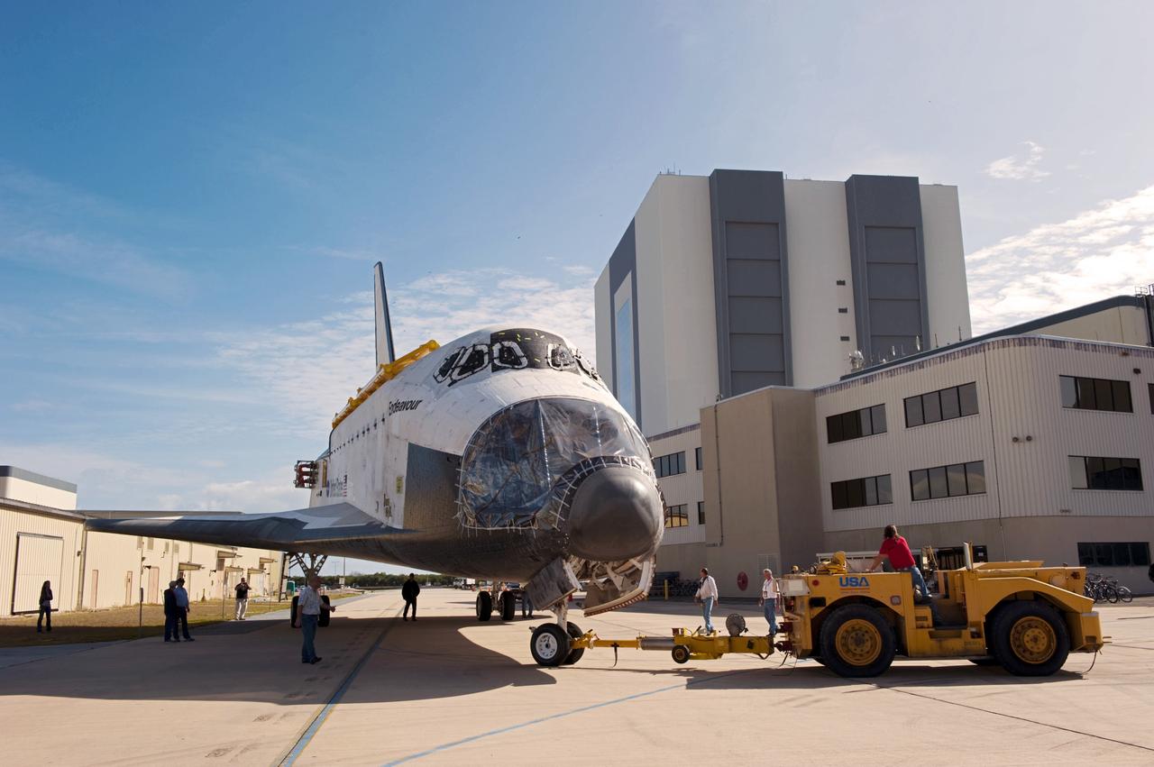 CAPE CANAVERAL, Fla. – At NASA’s Kennedy Space Center in Florida, space shuttle Endeavour is being towed from the Vehicle Assembly Building to Orbiter Processing Facility-2 (OPF-2). Shuttle Endeavour will remain in OPF-2 so that the orbiter maneuvering system (OMS) pods and forward reaction control system can be installed. Technicians also will offload water and Freon gas from lines located in Endeavour’s midbody. The work is part of Endeavour’s transition and retirement processing. The spacecraft is being prepared for public display at the California Science Center in Los Angeles. Endeavour flew 25 missions, spent 299 days in space, orbited Earth 4,671 times and traveled 122, 883, 151 miles over the course of its 19-year career. Endeavour’s STS-134 and final mission was completed after landing on June 1, 2011. Photo credit: Kim Shiflett