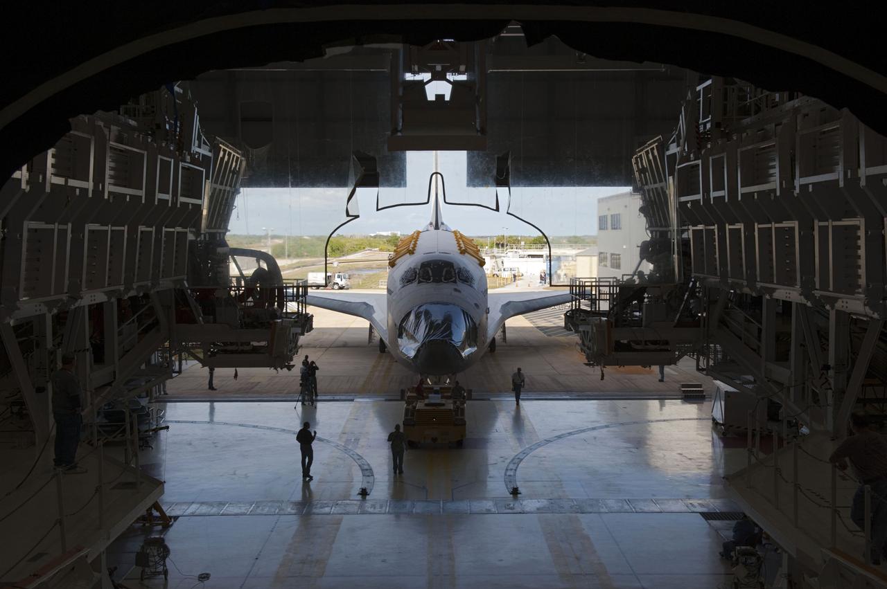 CAPE CANAVERAL, Fla. – At NASA’s Kennedy Space Center in Florida, space shuttle Endeavour is towed to Orbiter Processing Facility-2 (OPF-2). Shuttle Endeavour will remain in OPF-2 so that the orbiter maneuvering system (OMS) pods and forward reaction control system can be installed. Technicians also will offload water and Freon gas from lines located in Endeavour’s midbody. The work is part of Endeavour’s transition and retirement processing. The spacecraft is being prepared for public display at the California Science Center in Los Angeles. Endeavour flew 25 missions, spent 299 days in space, orbited Earth 4,671 times and traveled 122, 883, 151 miles over the course of its 19-year career. Endeavour’s STS-134 and final mission was completed after landing on June 1, 2011. Photo credit: Kim Shiflett