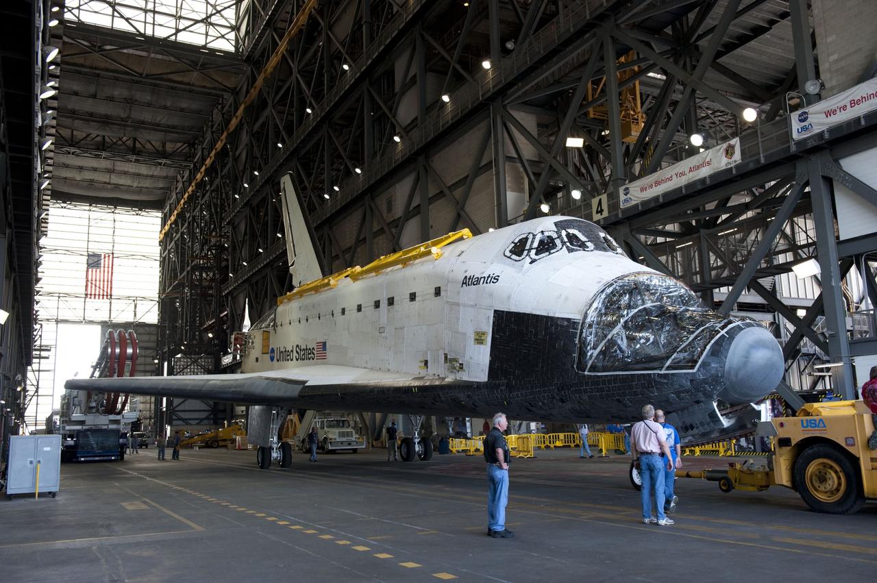 CAPE CANAVERAL, Fla. – Inside the Vehicle Assembly Building (VAB) at NASA’s Kennedy Space Center in Florida, technicians prepare space shuttle Atlantis to be towed out of the transfer aisle and around to the VAB high bay 4 doors.    Shuttle Atlantis will remain in temporary storage in high bay 4, while Space Shuttle Program transition and retirement work continues on Discovery and Endeavour in the orbiter processing facilities. Atlantis is being prepared for display at the Kennedy Space Center Visitor Complex.  Photo credit: NASA/Kim Shiflett