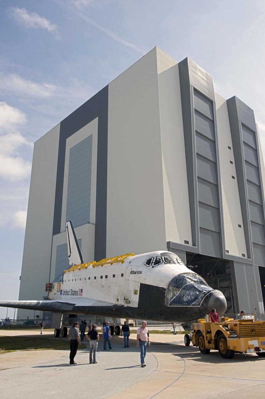CAPE CANAVERAL, Fla. – At NASA’s Kennedy Space Center in Florida, space shuttle Atlantis is towed from the Vehicle Assembly Building (VAB) transfer aisle on its way around to the VAB high bay 4 doors.    Shuttle Atlantis will remain in temporary storage in high bay 4, while Space Shuttle Program transition and retirement work continues on Discovery and Endeavour in the orbiter processing facilities. Atlantis is being prepared for display at the Kennedy Space Center Visitor Complex.  Photo credit: NASA/Kim Shiflett