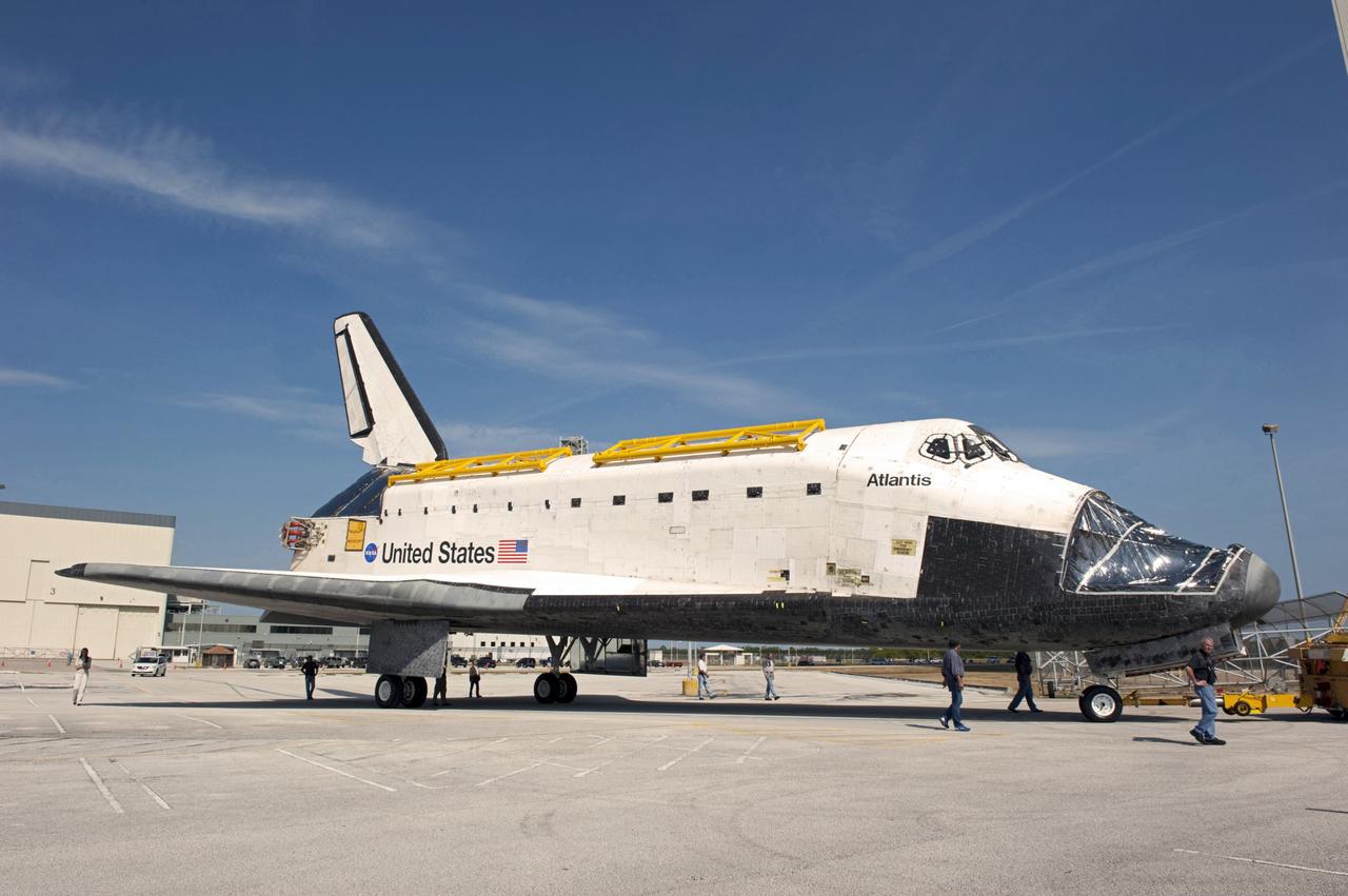 CAPE CANAVERAL, Fla. – At NASA’s Kennedy Space Center in Florida, space shuttle Atlantis is towed toward the Vehicle Assembly Building (VAB) high bay 4 doors after being towed around from the VAB transfer aisle.    Shuttle Atlantis will remain in temporary storage in high bay 4, while Space Shuttle Program transition and retirement work continues on Discovery and Endeavour in the orbiter processing facilities. Atlantis is being prepared for display at the Kennedy Space Center Visitor Complex.  Photo credit: NASA/Kim Shiflett
