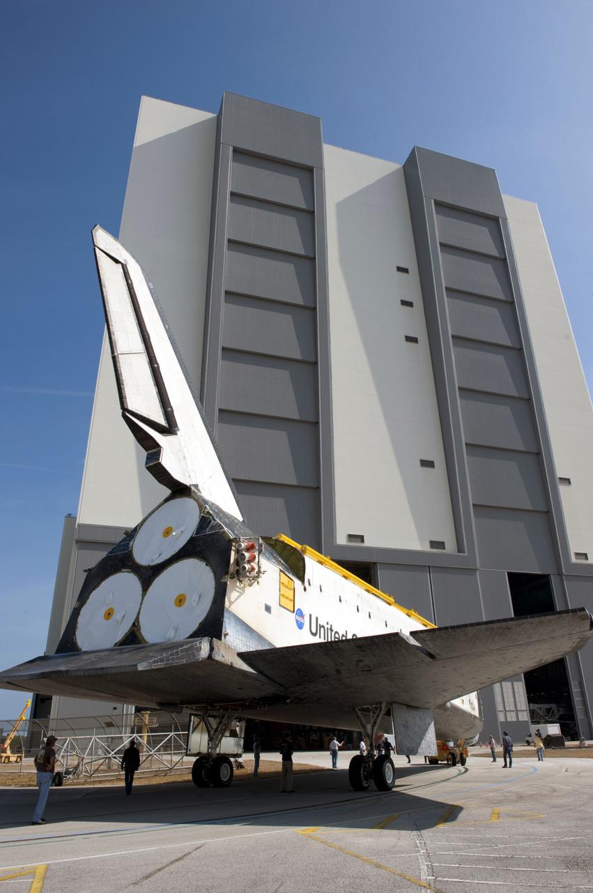 CAPE CANAVERAL, Fla. – At NASA’s Kennedy Space Center in Florida, space shuttle Atlantis is towed toward the Vehicle Assembly Building (VAB) high bay 4 doors after being towed around from the VAB transfer aisle.    Shuttle Atlantis will remain in temporary storage in high bay 4, while Space Shuttle Program transition and retirement work continues on Discovery and Endeavour in the orbiter processing facilities. Atlantis is being prepared for display at the Kennedy Space Center Visitor Complex.  Photo credit: NASA/Kim Shiflett