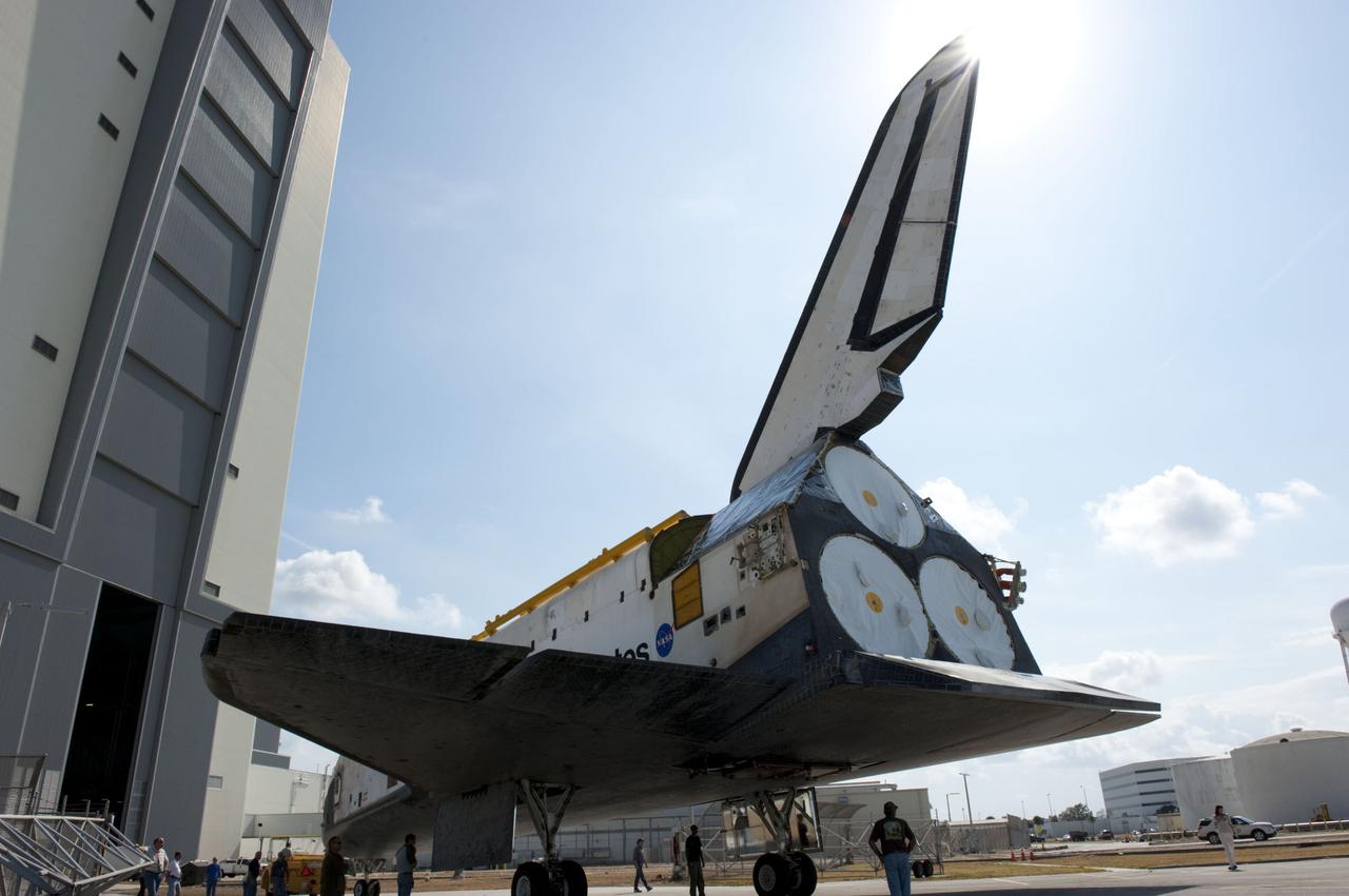 CAPE CANAVERAL, Fla. – At NASA’s Kennedy Space Center in Florida, space shuttle Atlantis is towed toward the Vehicle Assembly Building (VAB) high bay 4 doors after being towed around from the VAB transfer aisle.    Shuttle Atlantis will remain in temporary storage in high bay 4, while Space Shuttle Program transition and retirement work continues on Discovery and Endeavour in the orbiter processing facilities. Atlantis is being prepared for display at the Kennedy Space Center Visitor Complex.  Photo credit: NASA/Kim Shiflett