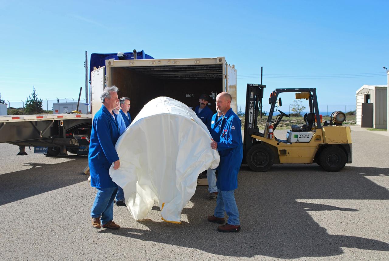 VANDENBERG AIR FORCE BASE, Calif. -- Workers unload the two halves that make up the Pegasus XL rocket's fairing that will protect the NuSTAR spacecraft during launch. Inside Orbital Science's processing facility, the fairing halves will be unwrapped and processed in a clean room environmental enclosure.       The Pegasus is set to launch NASA's NuSTAR spacecraft. Once the rocket and spacecraft are processed at Vandenberg, they will be flown on the Orbital Sciences’ L-1011 carrier aircraft to the Ronald Reagan Ballistic Missile Defense Test Site at the Pacific Ocean’s Kwajalein Atoll for launch. The high-energy x-ray telescope will conduct a census for black holes, map radioactive material in young supernovae remnants, and study the origins of cosmic rays and the extreme physics around collapsed stars. For more information, visit science.nasa.gov/missions/nustar/. Photo credit: NASA/Randy Beaudoin, VAFB