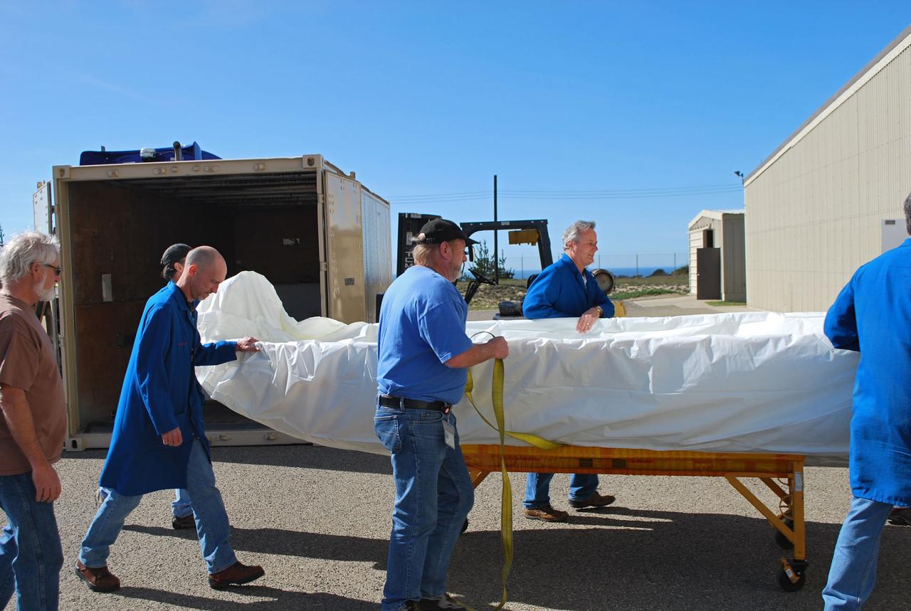 VANDENBERG AIR FORCE BASE, Calif. -- Workers unload the two halves that make up the Pegasus XL rocket's fairing that will protect the NuSTAR spacecraft during launch. Inside Orbital Science's processing facility, the fairing halves will be unwrapped and processed in a clean room environmental enclosure.       The Pegasus is set to launch NASA's NuSTAR spacecraft. Once the rocket and spacecraft are processed at Vandenberg, they will be flown on the Orbital Sciences’ L-1011 carrier aircraft to the Ronald Reagan Ballistic Missile Defense Test Site at the Pacific Ocean’s Kwajalein Atoll for launch. The high-energy x-ray telescope will conduct a census for black holes, map radioactive material in young supernovae remnants, and study the origins of cosmic rays and the extreme physics around collapsed stars. For more information, visit science.nasa.gov/missions/nustar/. Photo credit: NASA/Randy Beaudoin, VAFB