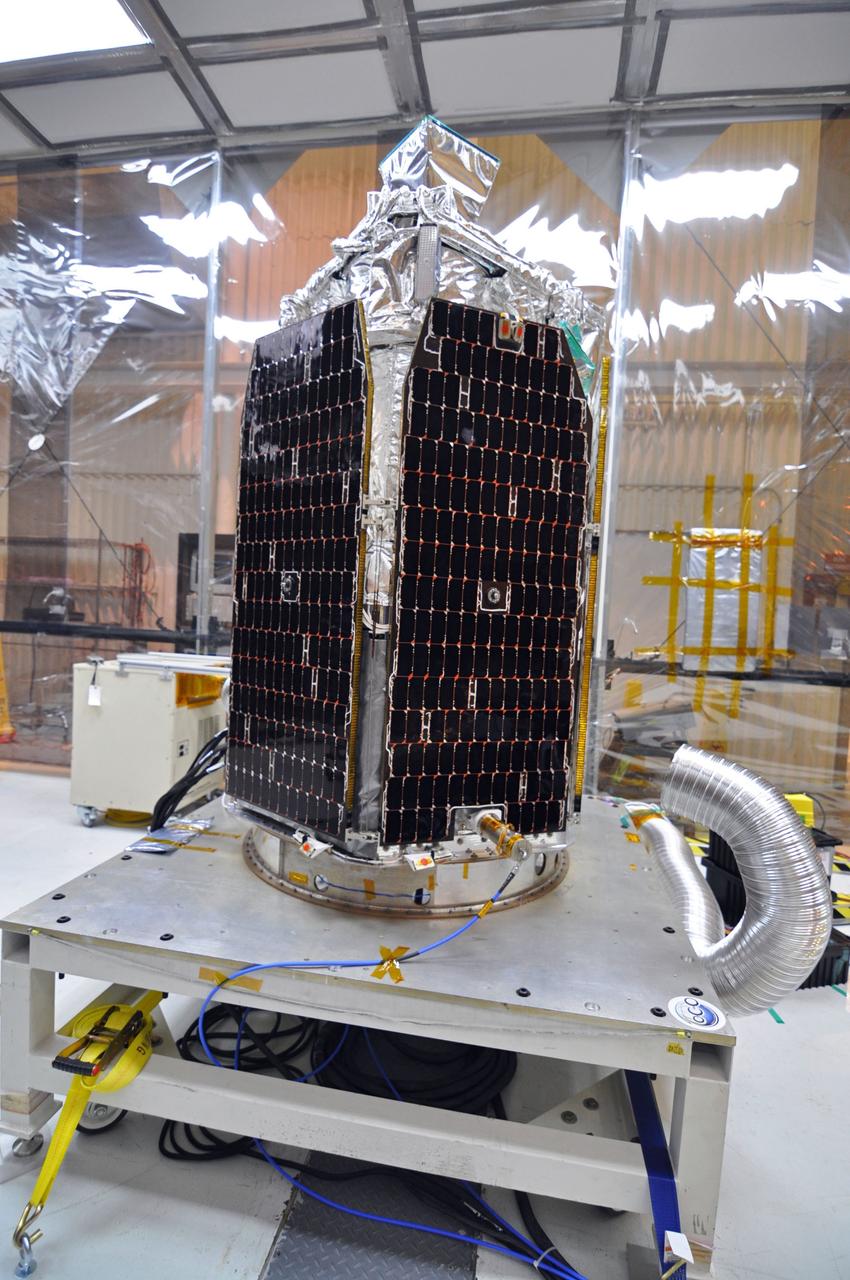 VANDENBERG AIR FORCE BASE, Calif. -- In a clean room at Vandenberg Air Force Base's processing facility in California, NASA's NuSTAR spacecraft is prepared for a solar array illumination test. A Pegasus XL rocket is set to launch NuSTAR into space. Once the rocket and spacecraft are processed at Vandenberg, they will be flown on the Orbital Sciences’ L-1011 carrier aircraft to the Ronald Reagan Ballistic Missile Defense Test Site at the Pacific Ocean’s Kwajalein Atoll for launch. The high-energy x-ray telescope will conduct a census for black holes, map radioactive material in young supernovae remnants, and study the origins of cosmic rays and the extreme physics around collapsed stars. For more information, visit science.nasa.gov/missions/nustar/. Photo credit: NASA/Randy Beaudoin, VAFB